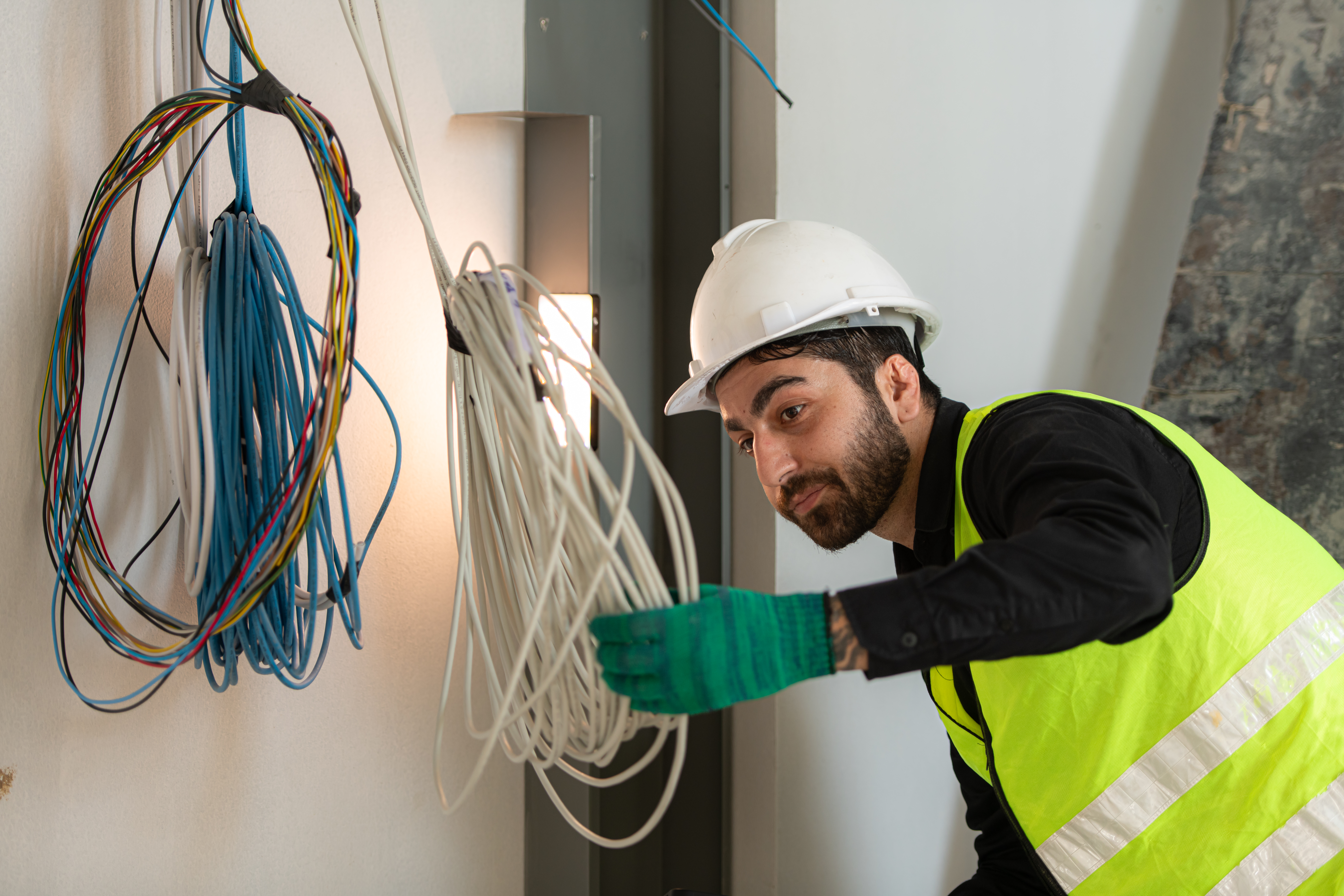 Engineers working on construction site, they are monitoring the building's electrical system.