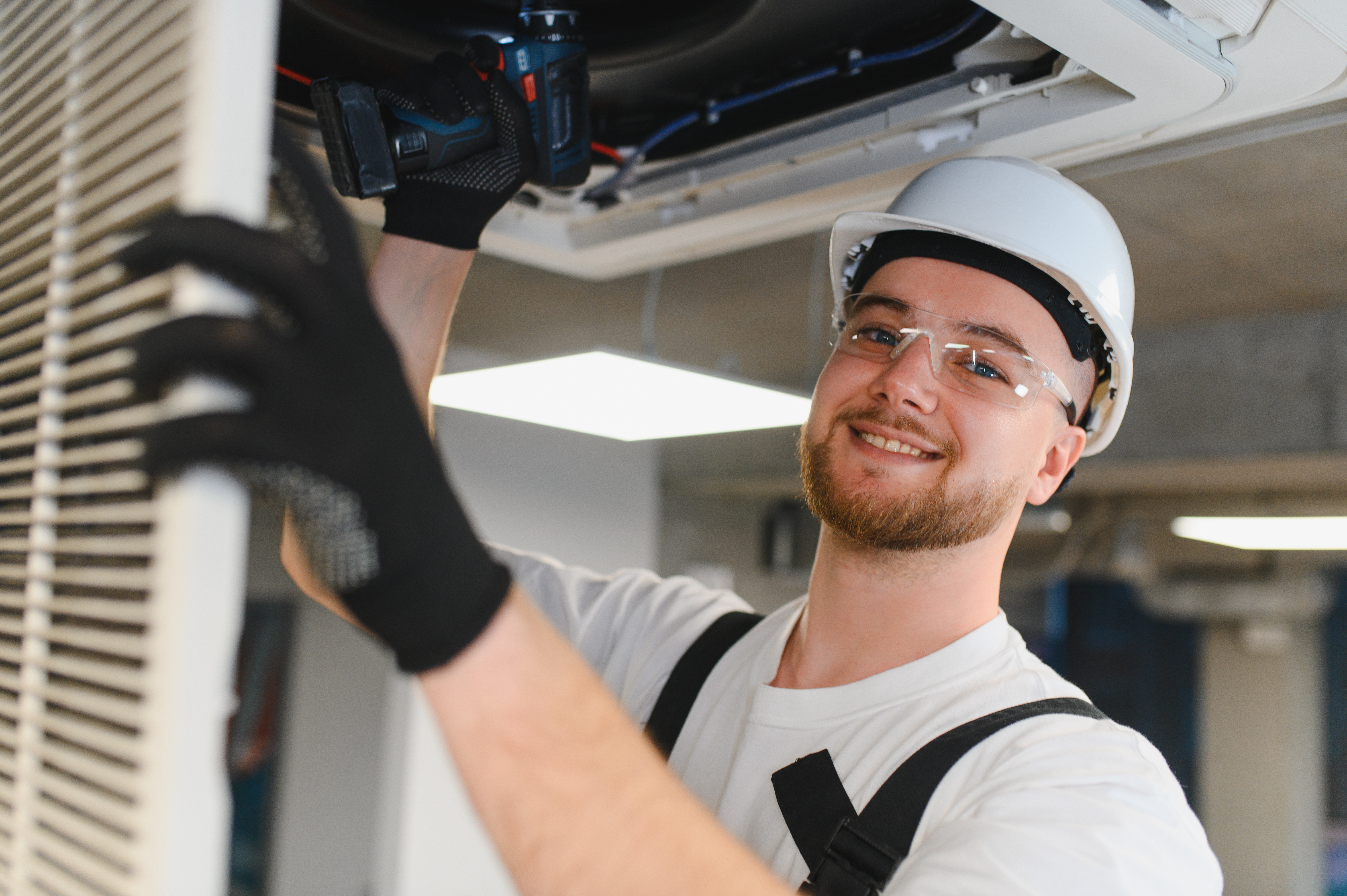 Hvac technician installing a new air conditioner, ensuring proper ventilation and temperature control indoors